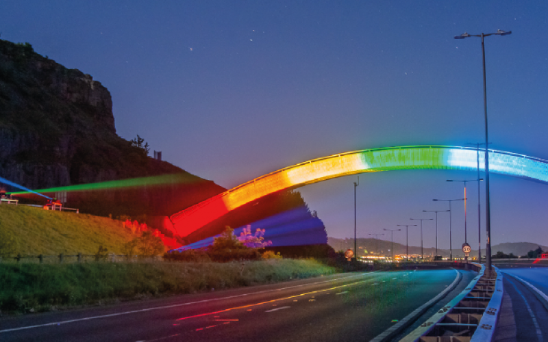 'Thank you key workers' rainbow projected onto a bridge at dusk