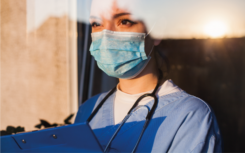 Nurse with mask on and stethoscope around their neck