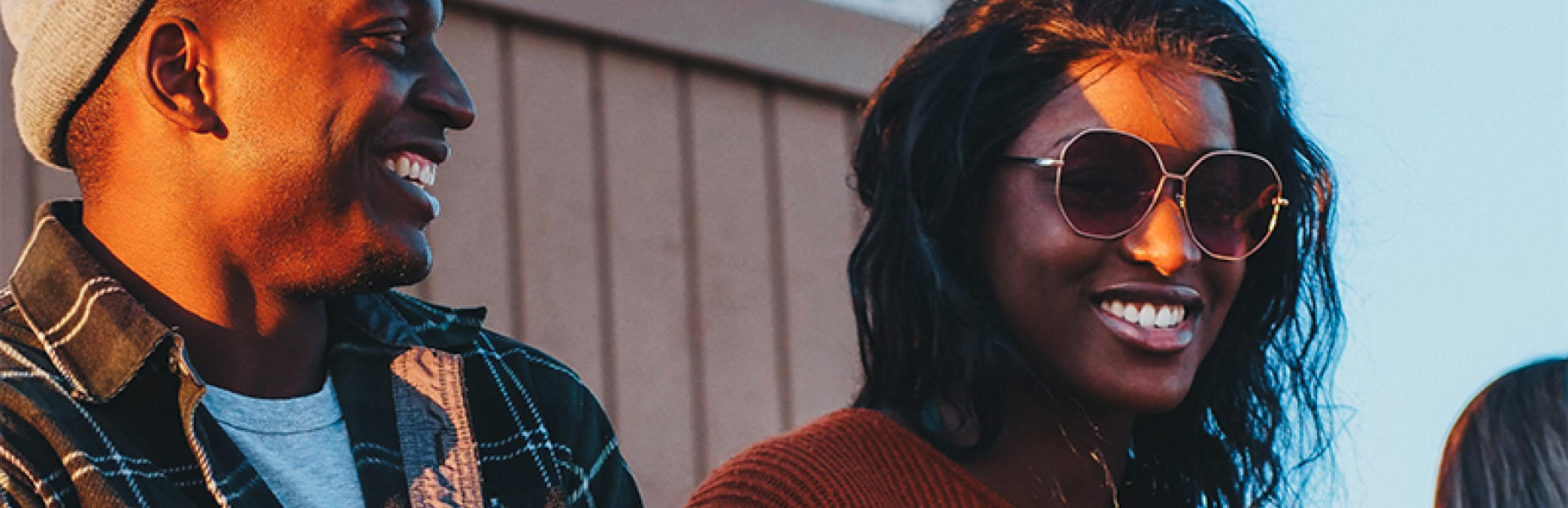 Two people sitting outside laughing 