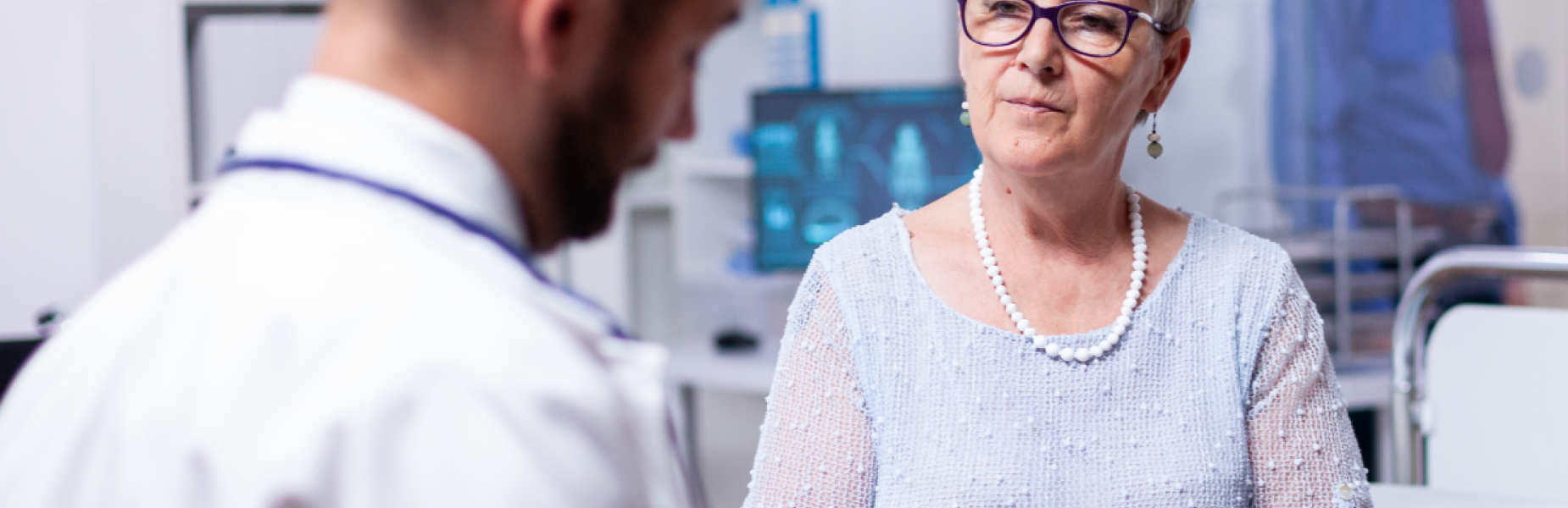 Health professional discussing medical notes with a patient