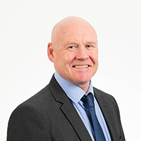Headshot photograph of Huw Rees